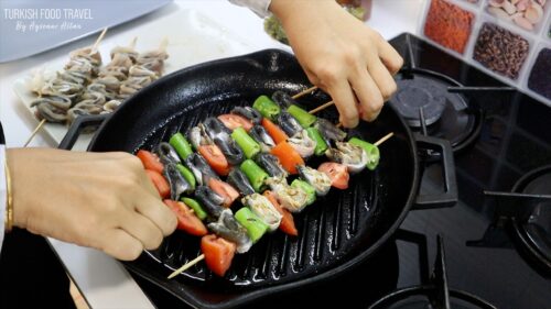 Grilling wrapped sardines